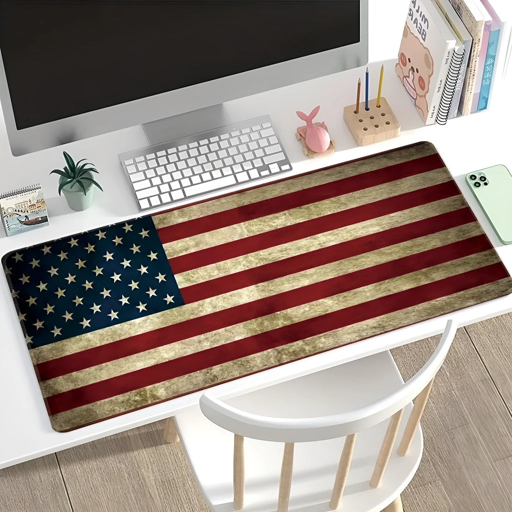 Large rectangular desk mouse pad with colourful printed pattern on natural rubber non-slip base.