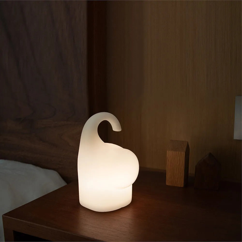 DOMI Elephant silicone night light with soft white glow on bedside table