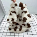 Small dog wearing a pink or brown plush warm coat in British style for Teddy and Bichon breeds