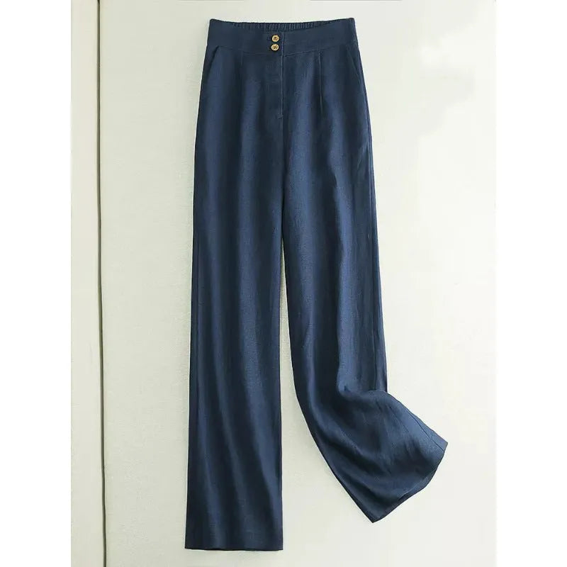Woman wearing high-waist wide-leg casual trousers in a cotton-linen blend, shown in earth gold colour.
