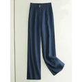 Woman wearing high-waist wide-leg casual trousers in a cotton-linen blend, shown in earth gold colour.
