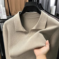 Men's loose fit long sleeve pullover sweater in green, shown flat.