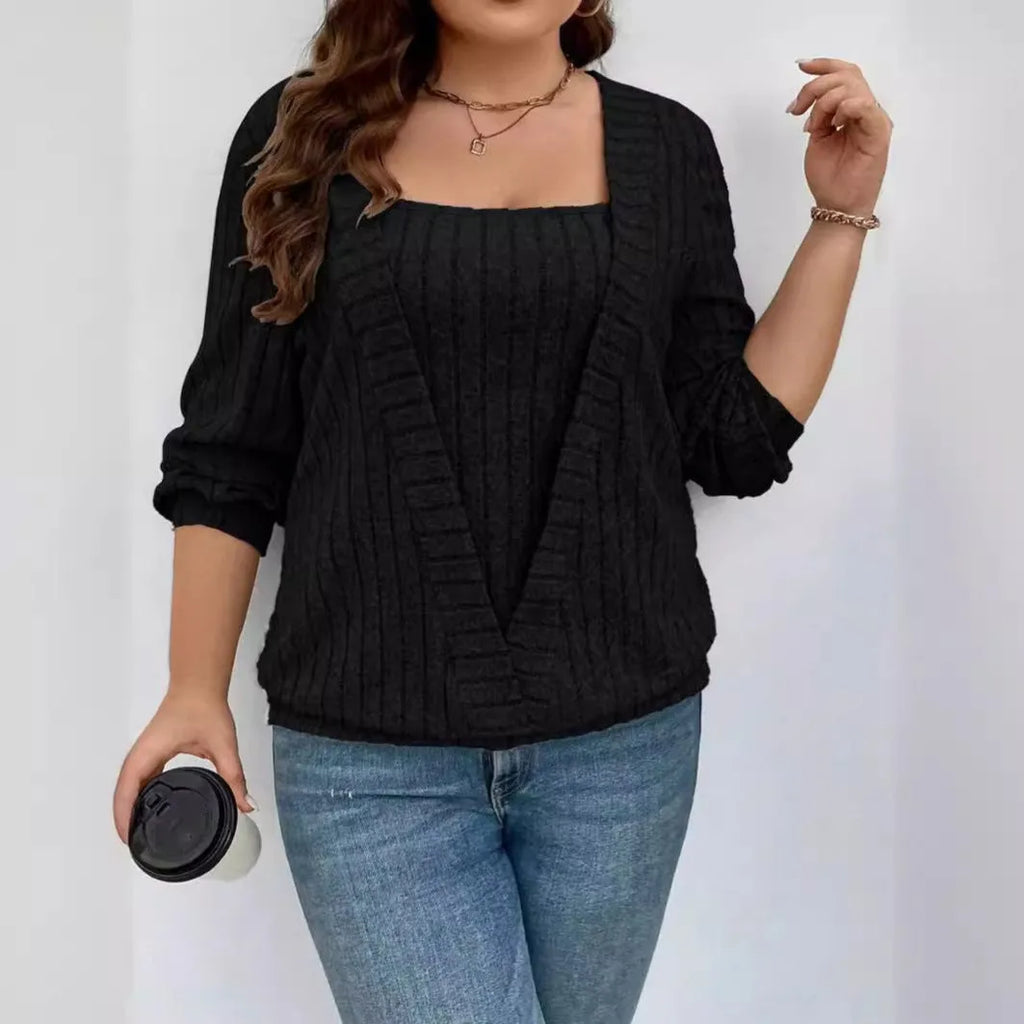 Women's solid colour false two-piece suit with V-neck and long sleeves in polyester rib fabric.