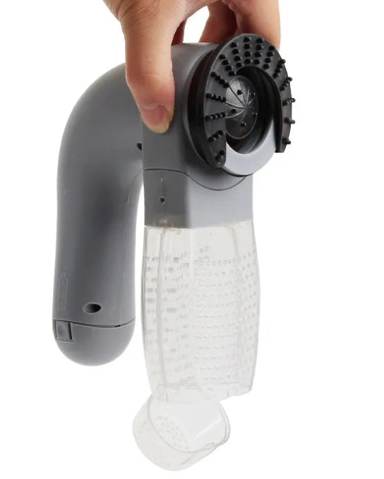 Grey handheld electric pet hair vacuum cleaner with soft rubber brush head for grooming dogs and cats
