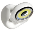 White Atomic Angel induction desk lamp with compact ABS plastic housing on a desk.