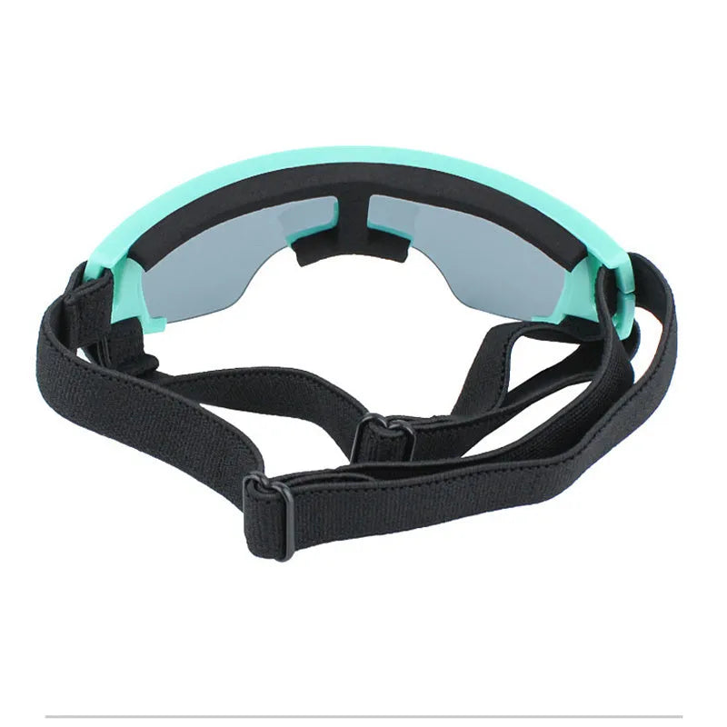 Dog UV-proof goggles with PC lens and adjustable nylon strap in black colour on a plain background