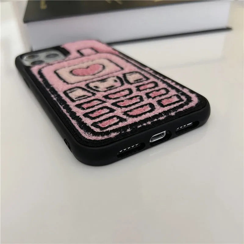 Pink towel embroidered soft TPU back cover case for Apple iPhone mobile phones.