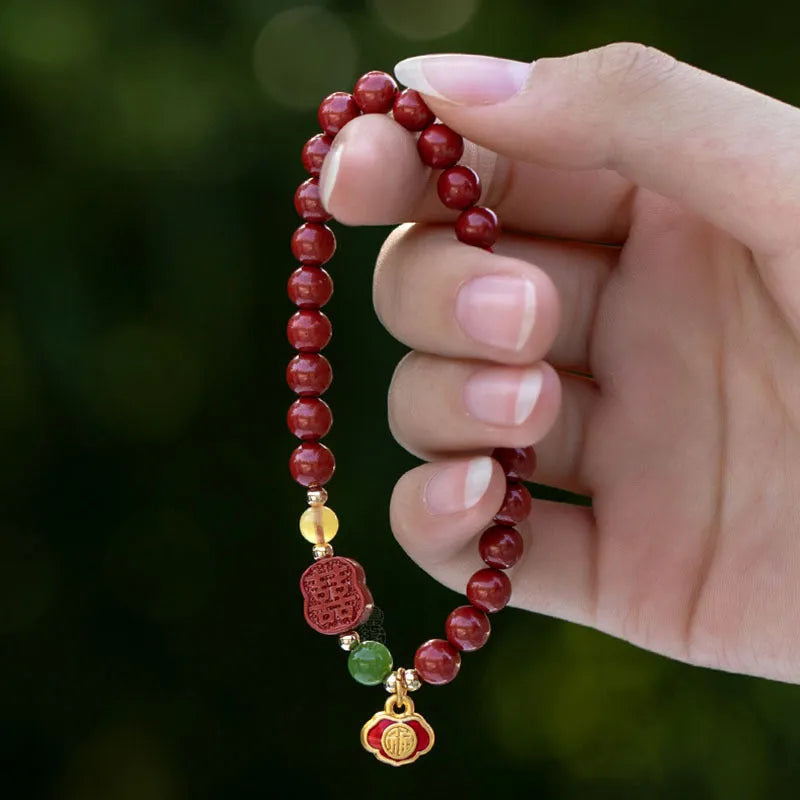 Emperor sandstone cinnabar bracelet with fu character and happy eyebrow design