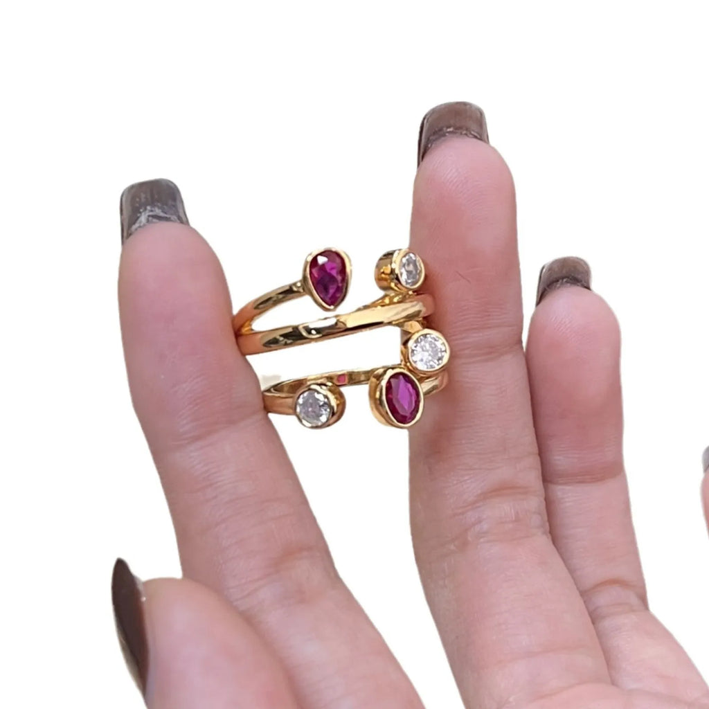 Double-headed geometric ring with irregular cross design in two-tone colours