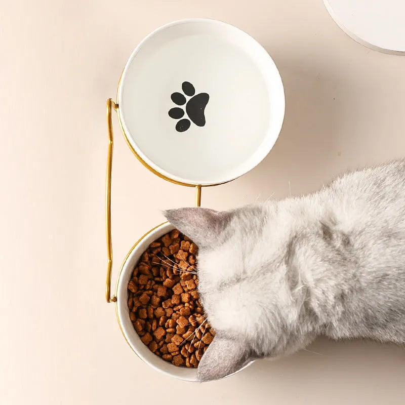 Ceramic cat bowl with iron frame in cat paw or fishbone print