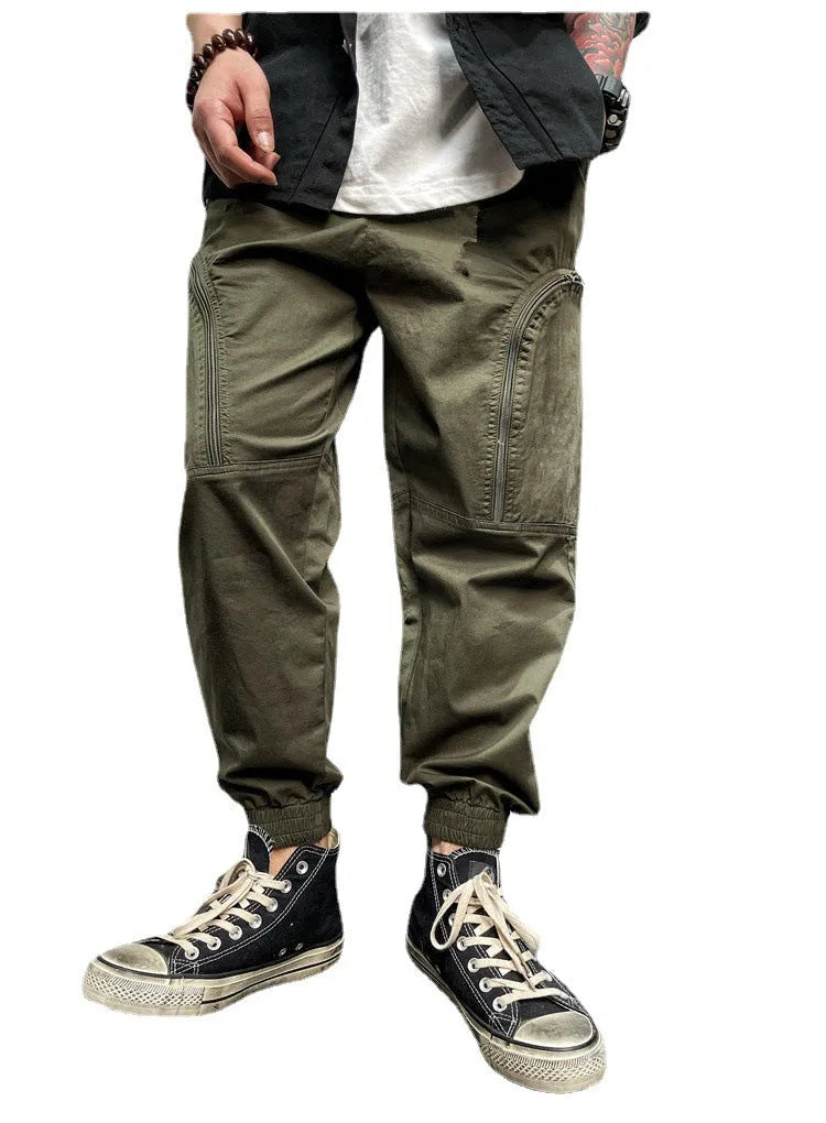 Men's loose-fit cotton cargo trousers with elastic waist, zipper, and multiple big pockets in army green
