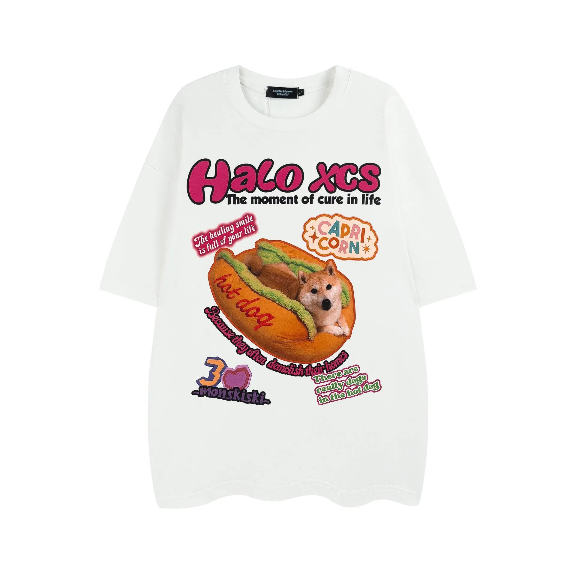 White cotton t-shirt with a cartoon print of a hamburger and a dog, showing a round neck and short sleeves.
