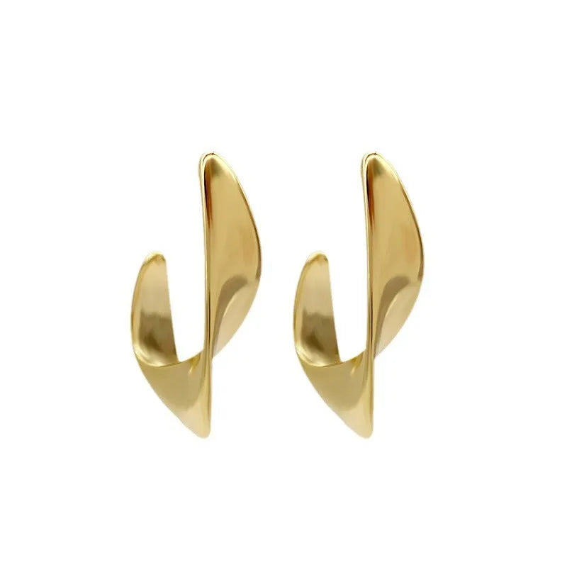Metal twisted geometric earrings with round elements in gold or silver electroplated finish