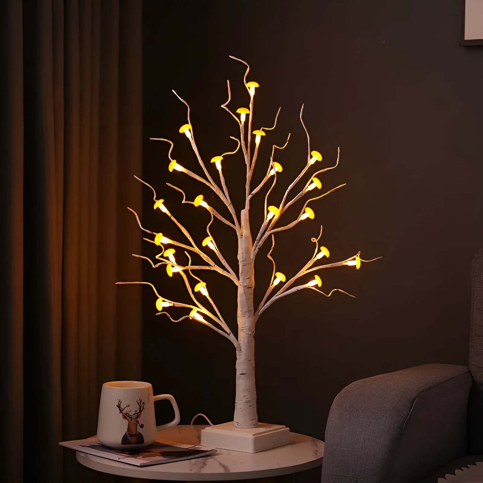 60cm tall white birch tree LED lamp with 24 small lit mushroom flowers on its branches.