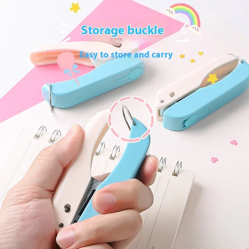 Small manual embossing punch tool showing Love, Star, and round hole shapes for paper crafts