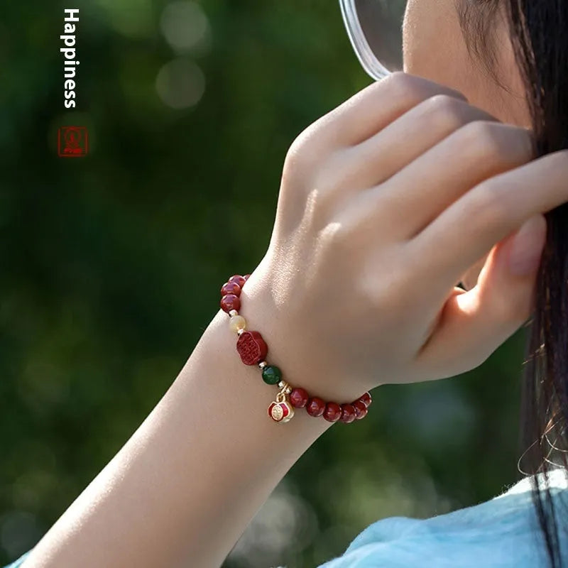 Emperor sandstone cinnabar bracelet with fu character and happy eyebrow design