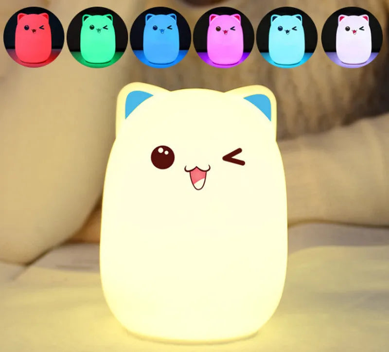 Cartoon silicone clapping lamp in Princess Bear style showing warm white light on a wooden table