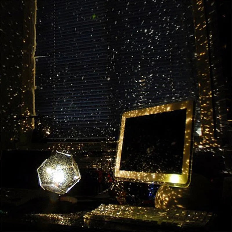 LED star projector night light showing constellation projection on a dark ceiling