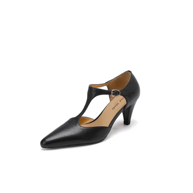 Brown retro women's T-strap sandals with a closed toe, buckle fastening, and a short stout heel.