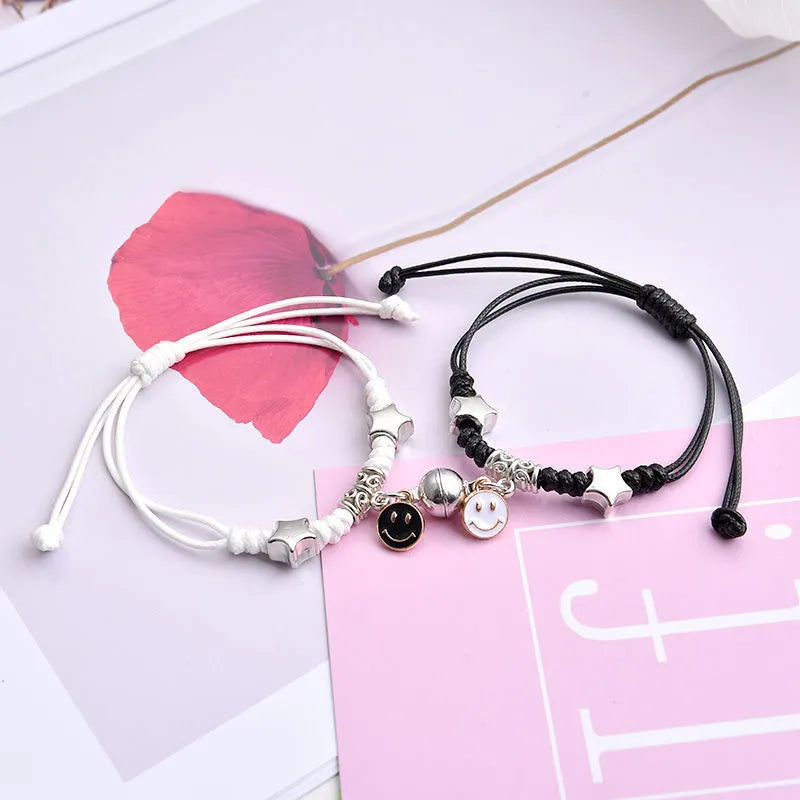 Alloy magnetic suction bracelet pair for couples with symbolic design options