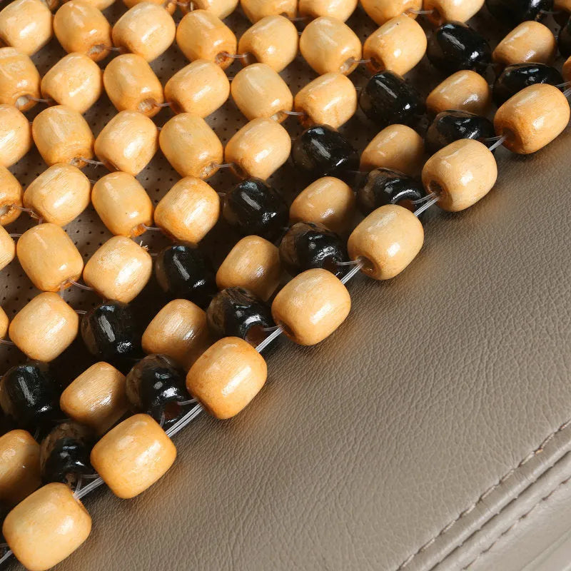 Beige and black car seat cushions with breathable mesh fabric and elastic strap fastening