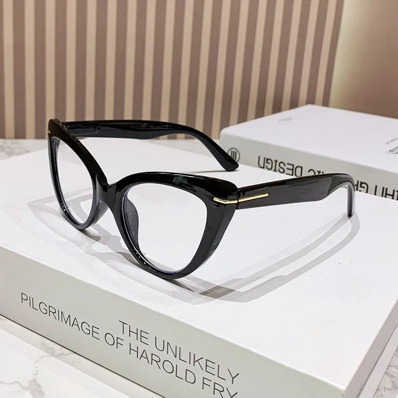 Women's cat eye reading glasses with large frames showing dragon and phoenix decorations