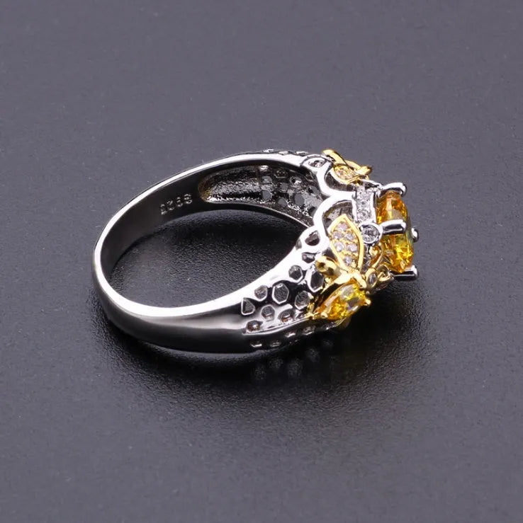 Geometric alloy ring with simulated zircon centre, available in sizes 6-10