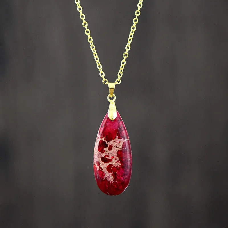 Emperor Stone jade pendant necklace with 18K gold plating, showing heart-shaped design in red silver finish.