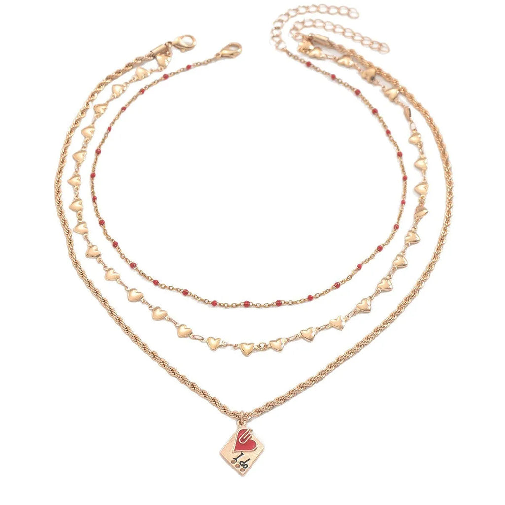 Silver-tone adjustable clavicle chain necklace with a geometric heart pendant on a three-layer chain.