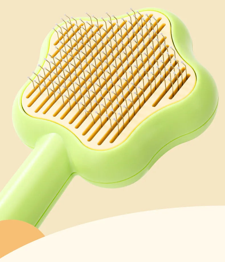 Self-cleaning stainless steel needle cat comb with magic wand handle in green or yellow