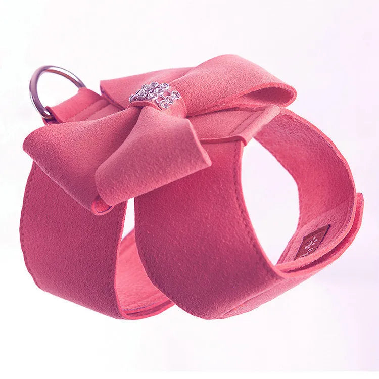 A soft microfiber dog chest strap with a decorative bowknot, shown in pink, blue, and orange colour options.