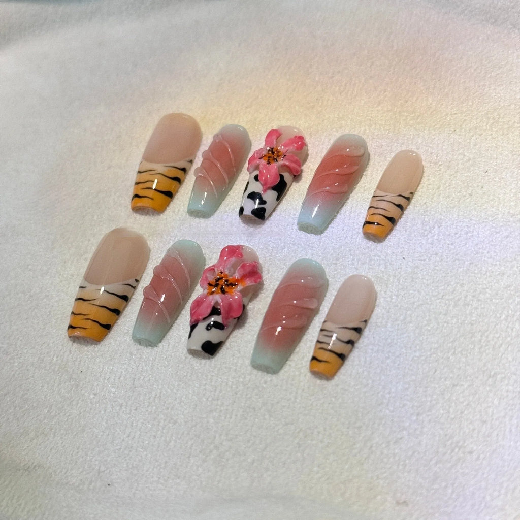 Zebra pattern hand carving nail art with embossed flower and leopard print designs in four sizes