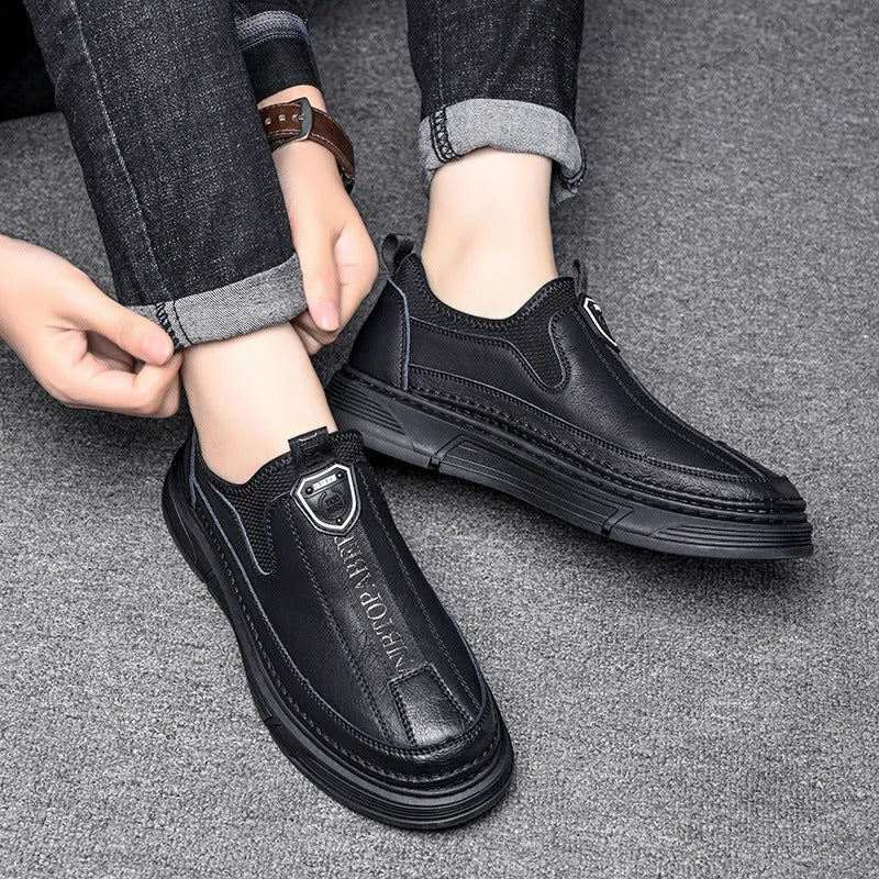 Men's black and brown casual leather shoes with round toe design shown from side view