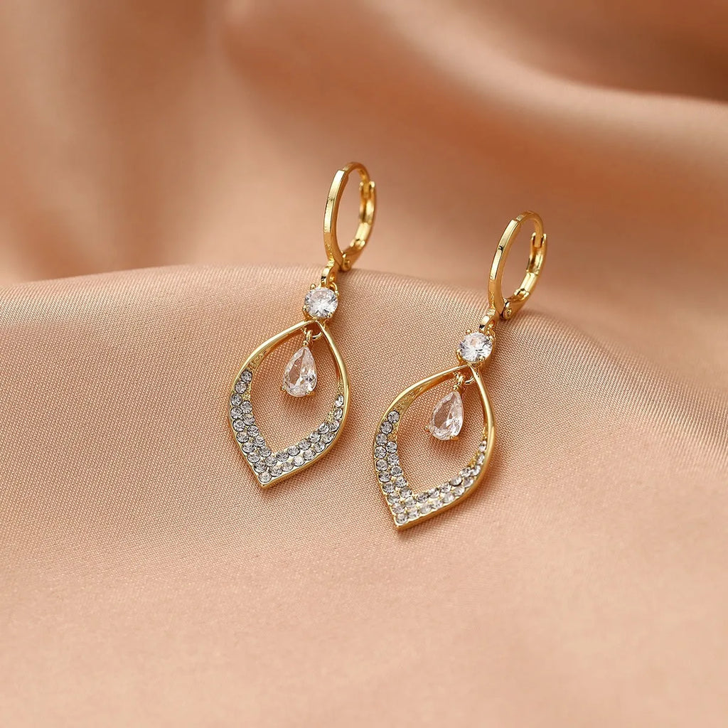 Women's gold or silver coloured zircon water drop earrings with a dangling tassel.