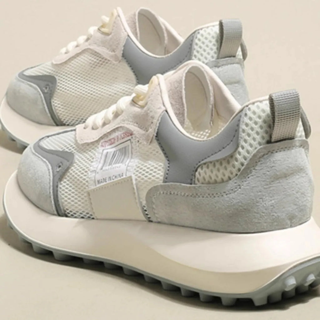 Women's grey and pink retro sneaker with low-top design and rubber sole