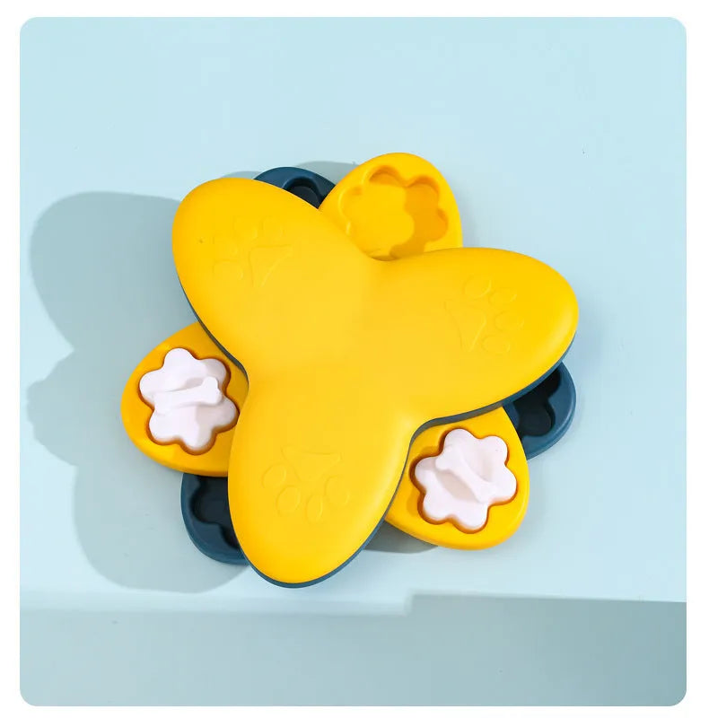 Green dog puzzle toy with bone-shaped covers showing nine compartments for treat dispensing