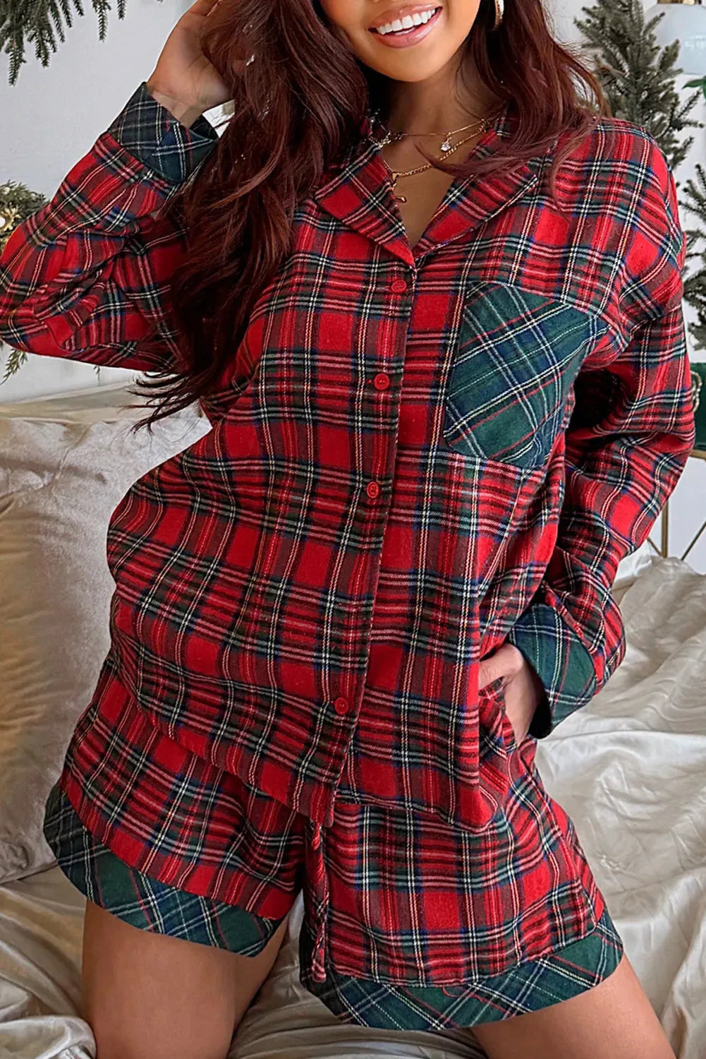Red plaid Christmas pyjama set with long sleeve shirt and matching shorts in polyester-cotton blend fabric