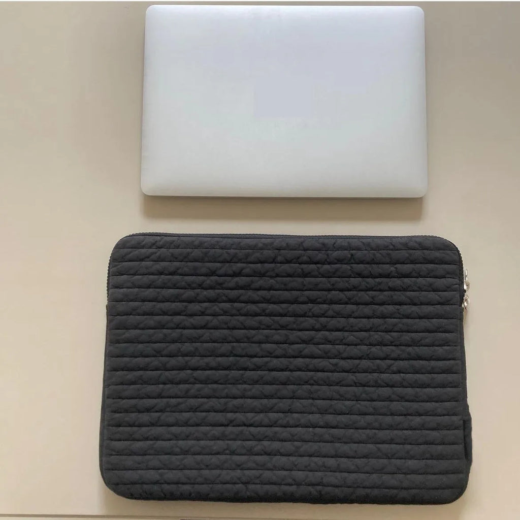 Black and white hand-held cotton cloth laptop clutch bag for tablet protection with coin pocket.