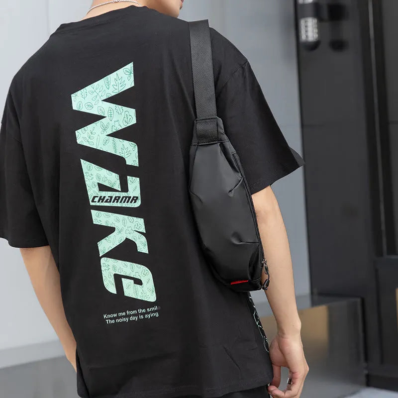 Black oxford cloth men's crossbody bag showing front zipper and internal phone and ID pockets.