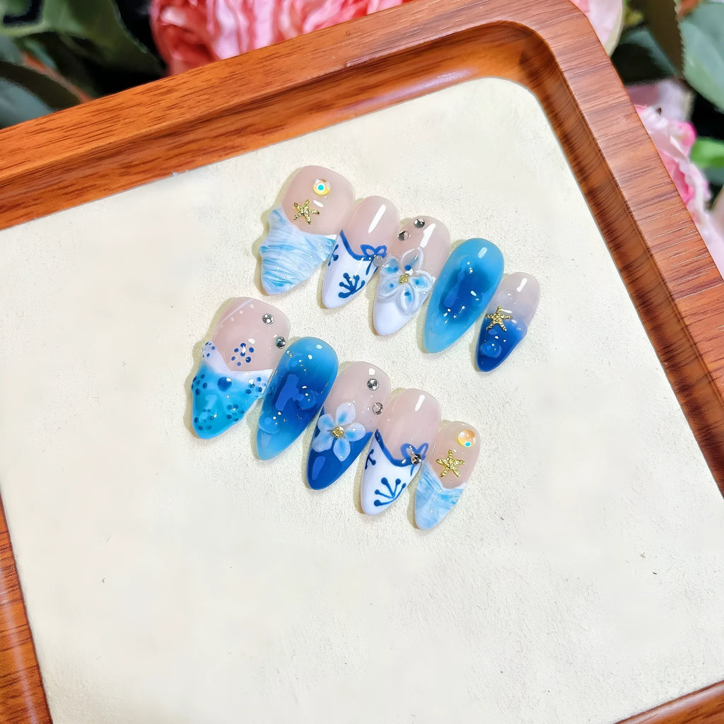 Blue hand-painted carved summer ice transparent plastic fake nails showing carved texture and transparent quality