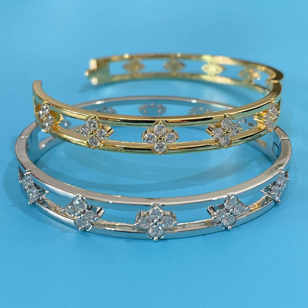 Women's hollow bracelet with four-leaf clover design and inlaid zircon stones