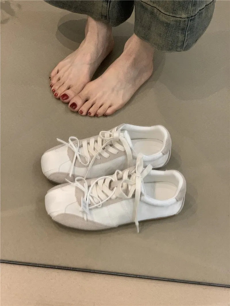 Girlish style bow white sneaker for women, low-top round toe, black colour option, side view