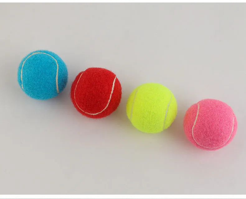 Bite-resistant rubber dog tennis ball toy in bright pink, 6.3cm diameter.