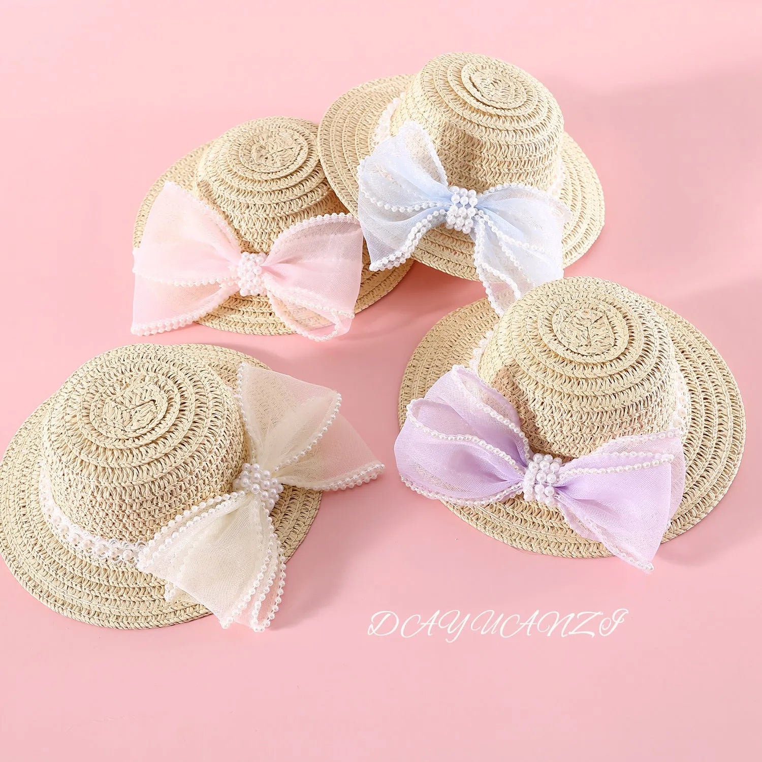 Woven Lafite leaf cat hat with pearl butterfly bow on a pink background, showing S and M size options.