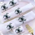 Six black spider-shaped alloy metal napkin rings for Halloween table decoration