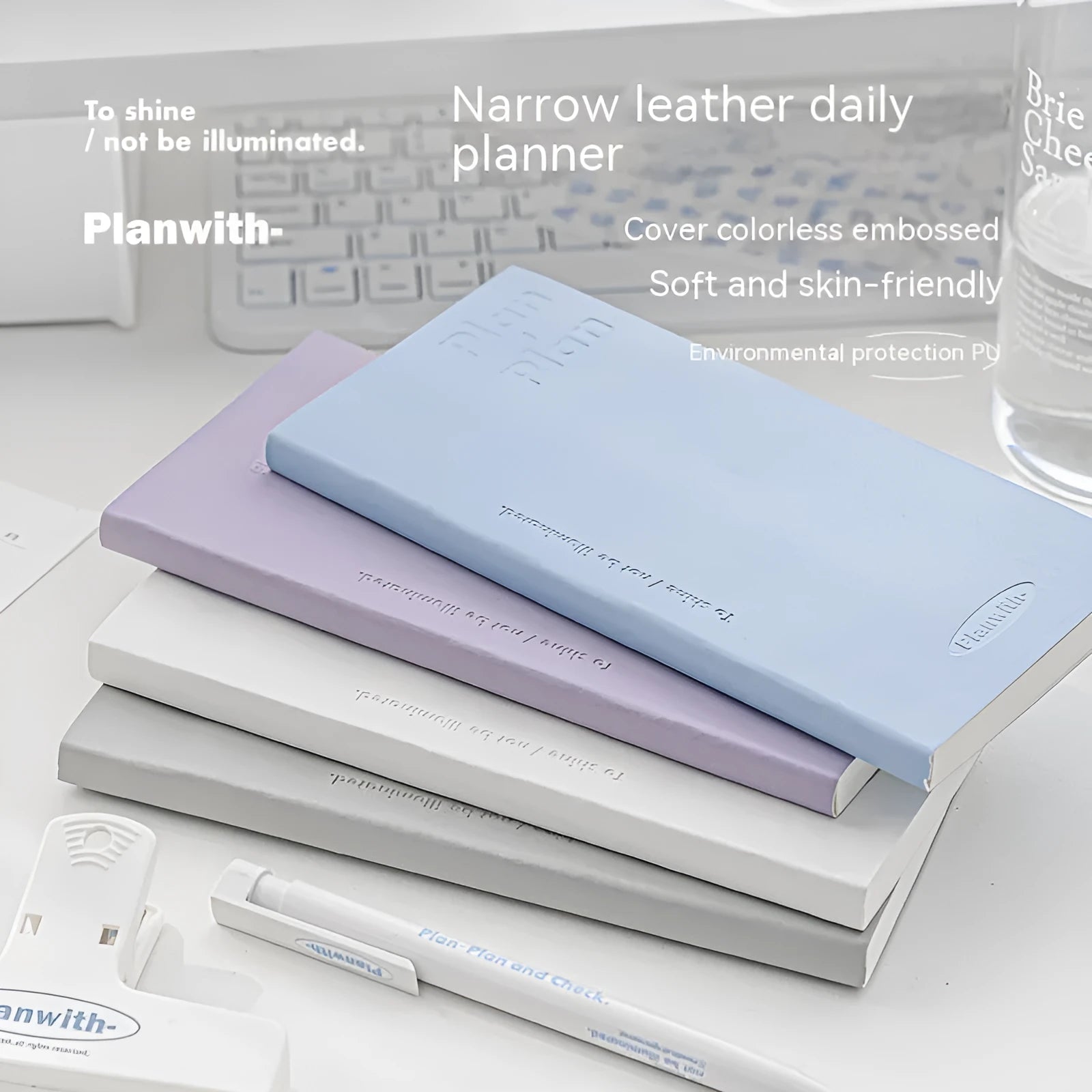 Embossed simple visual daily meter notebook in blue, showing its cover and page layout.