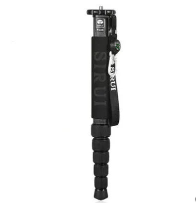 Black carbon fibre monopod for DSLR cameras extended to maximum height