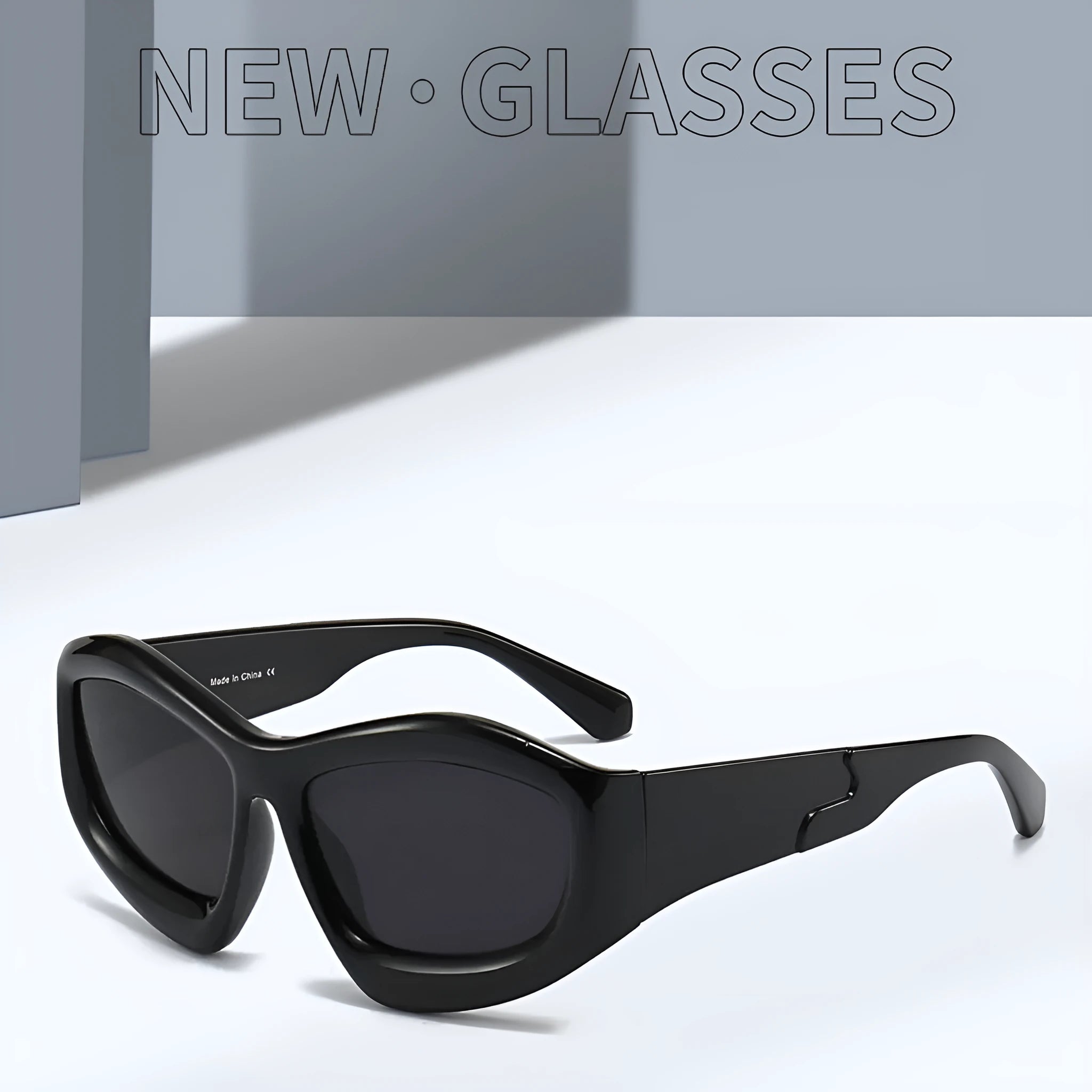 Unisex concave shape sunglasses with black frame and black grey lens, bubble style design for outdoor use