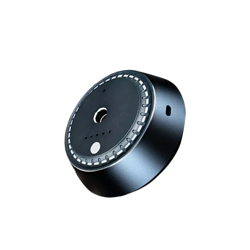 Black metal smart car aroma diffuser with USB cable, showing compact 9cm by 4.5cm size.