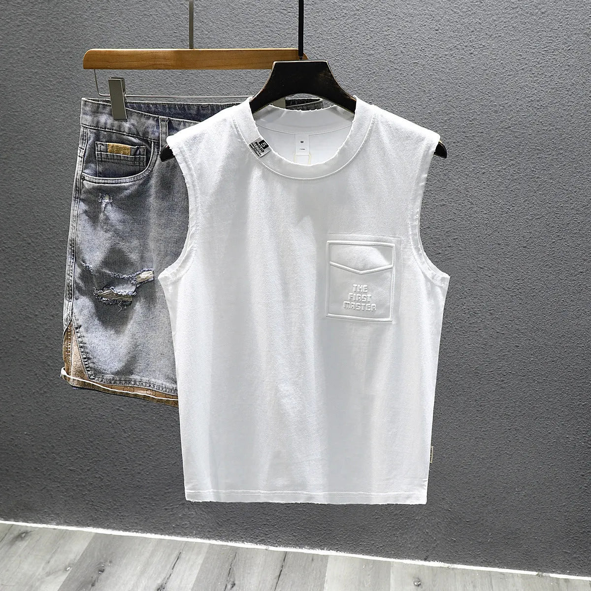 Cotton sleeveless t-shirt in loose fit with straight hem, black and white colour options